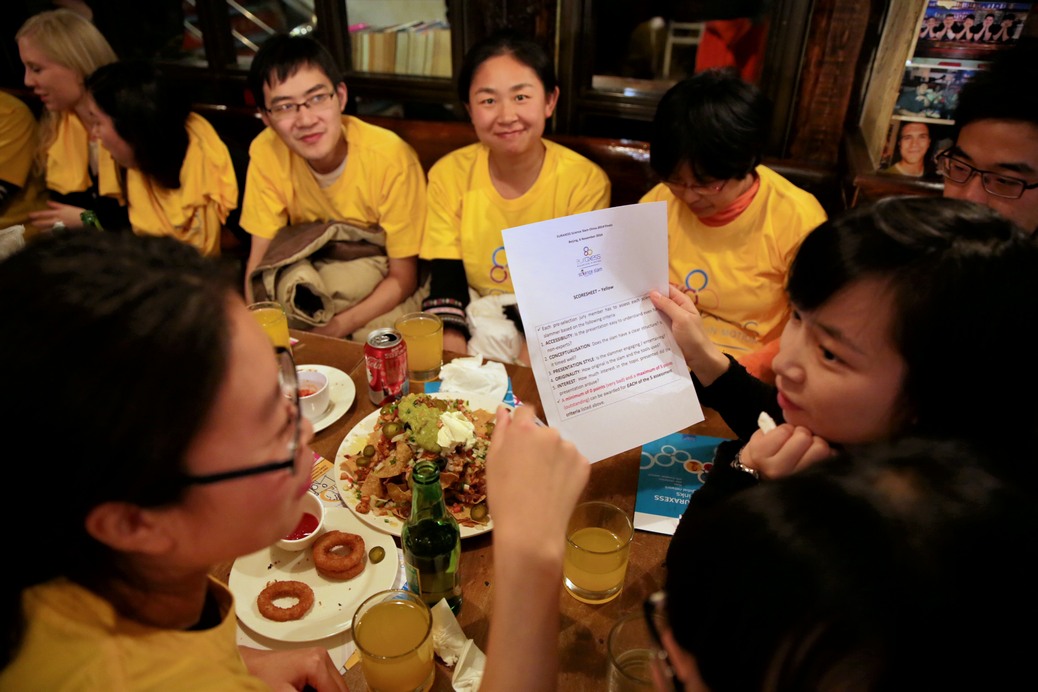 Evaluation forms are filled out by each table. Photo by EURAXESS